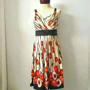 COOSK floral dress  with cream base and black beaded belt and shoulders. Size 2
